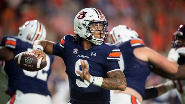 Auburn Tigers quarterback Robby Ashford (9) drops back to pass in the first quarter Auburn Tigers take on Mississippi Rebels at Jordan-Hare Stadium in Auburn, Ala., on Saturday, Oct. 21, 2023. 